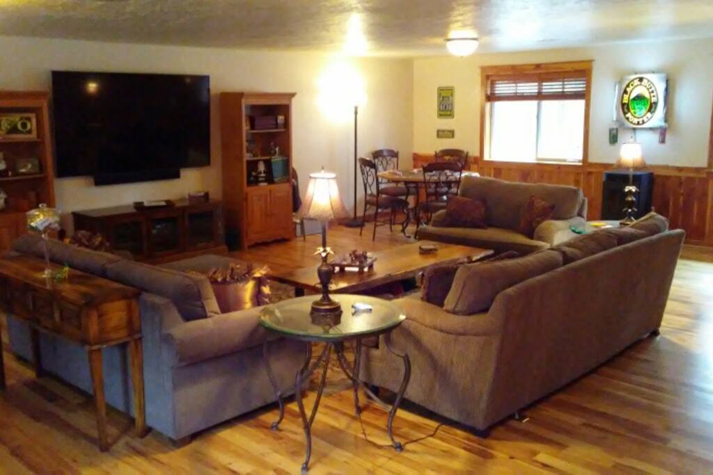 The living room with 80" TV and surround sound.
