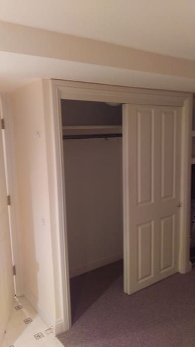 Closet adjacent to door entering kitchen/living space