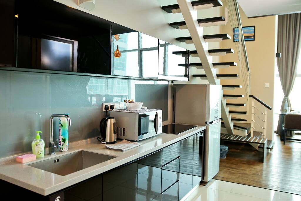 Kitchen with microwave, refrigerator,boiler,vacuum flask,electric stove,pot, pan and cutlery set