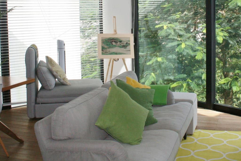 Bright living room with green views
