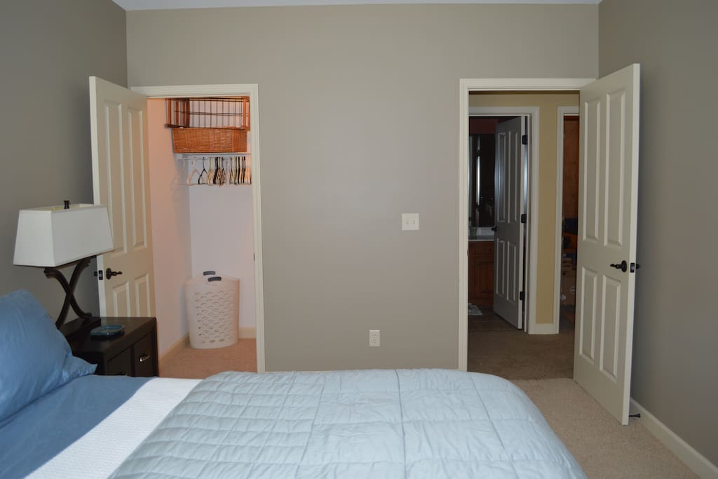 Shows deep closet and entrance to bathroom dedicate to this guest room