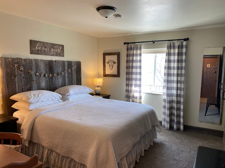 King bed with private bathroom. Room #2 at the Circle View Guest Ranch.