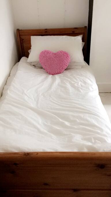Single bed in triple room.