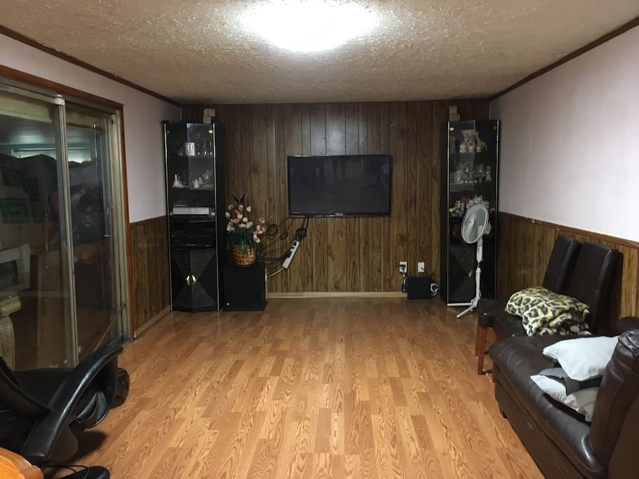 Family room with sofa bed and massage chair.