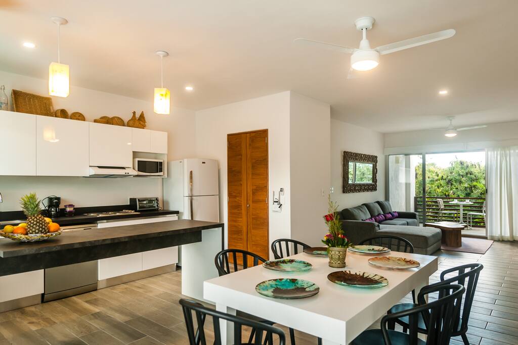 Dining area with a terrace overlooking the pool