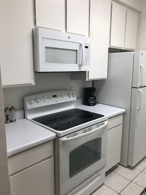 Kitchen has a new microwave and range.