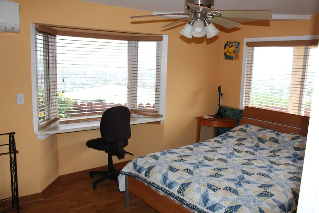 1st bedroom with a queen bed