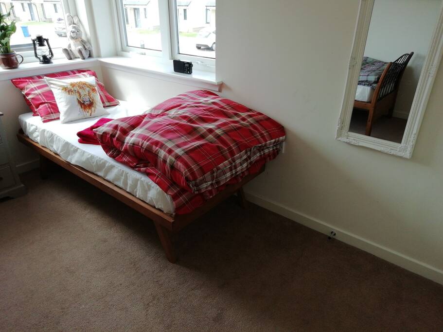 One of the two beds. Room view on the hill and the street. Back garden view on the hills, and Beauly firth.