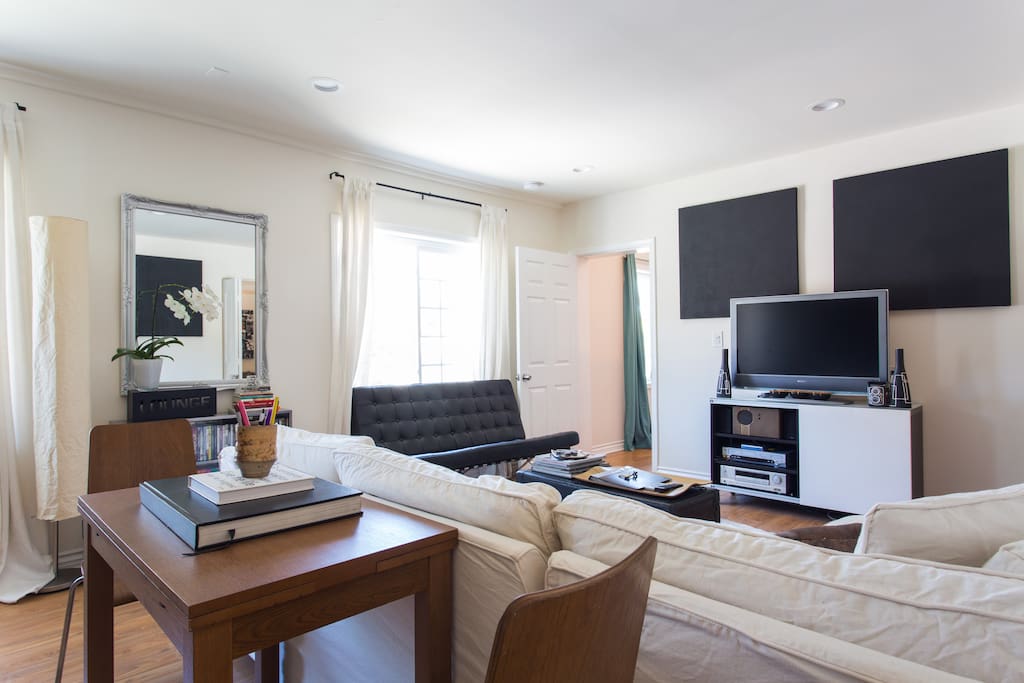 Living room: elegant, clean, modern design, East meets West, fully equipped entertainment center, can sleep 2 on the couch or use the provided air mattress