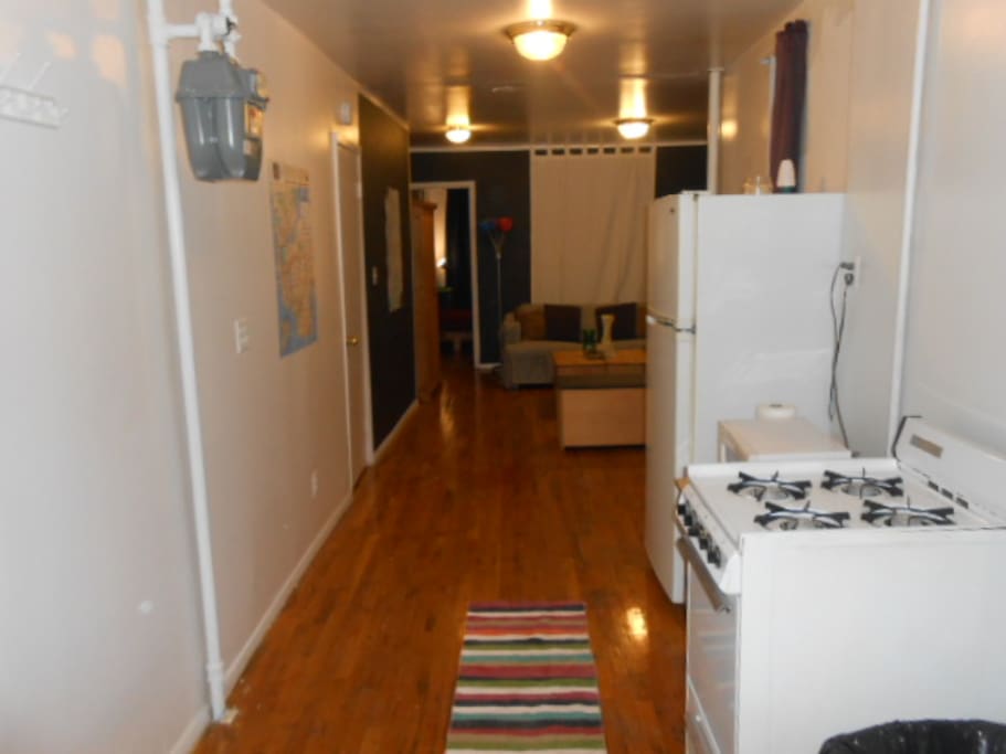 Kitchen - Great Room in Background - Bedroom at Left