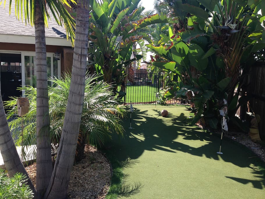 Front of house with putting green