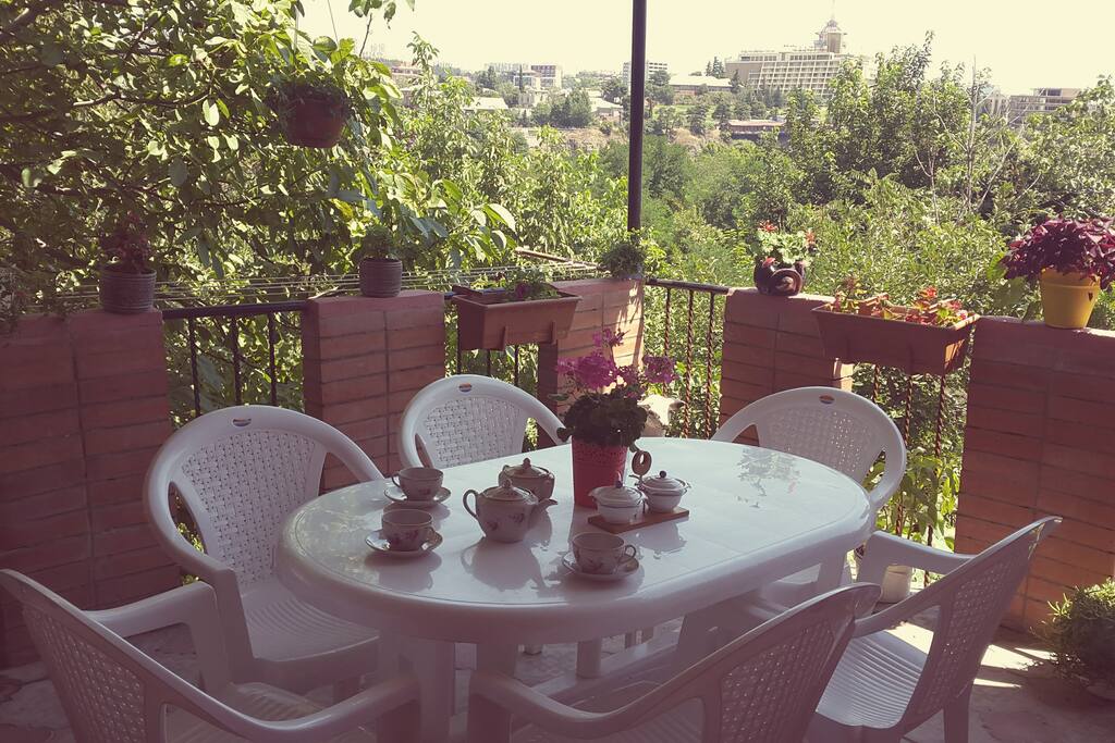 Balcony in Summer filled with flowers and green everywhere :)
