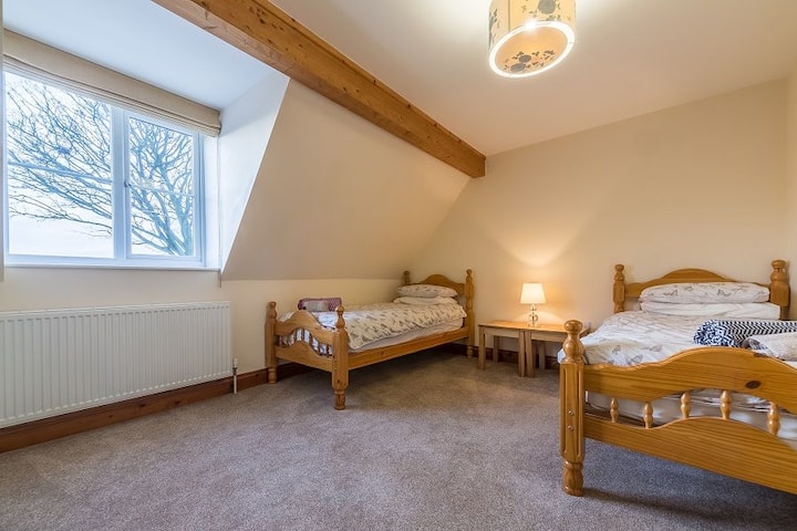large twin bedroom with lovely open views