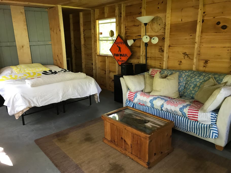 The cabin is essentially a studio with a private sleeping nook and a private (curtained) bathroom.