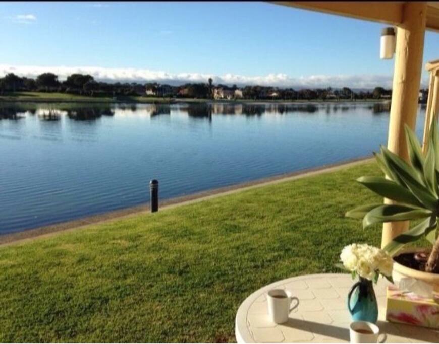 Patio area with view of lake
