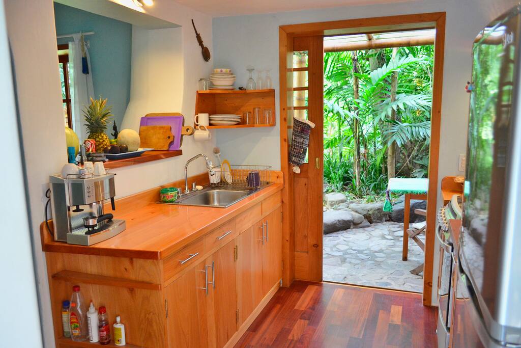 Fully equipped kitchen, door to private covered porch and shared garden