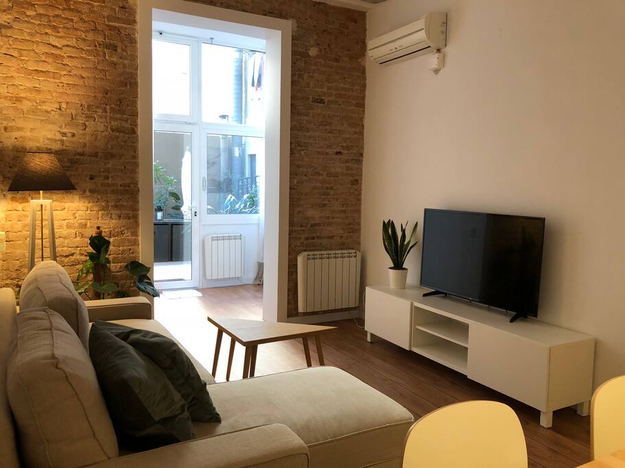 Comfortable and spacious living & dining room equipped with 49" TV, sofa bed, AC, fan and heaters.