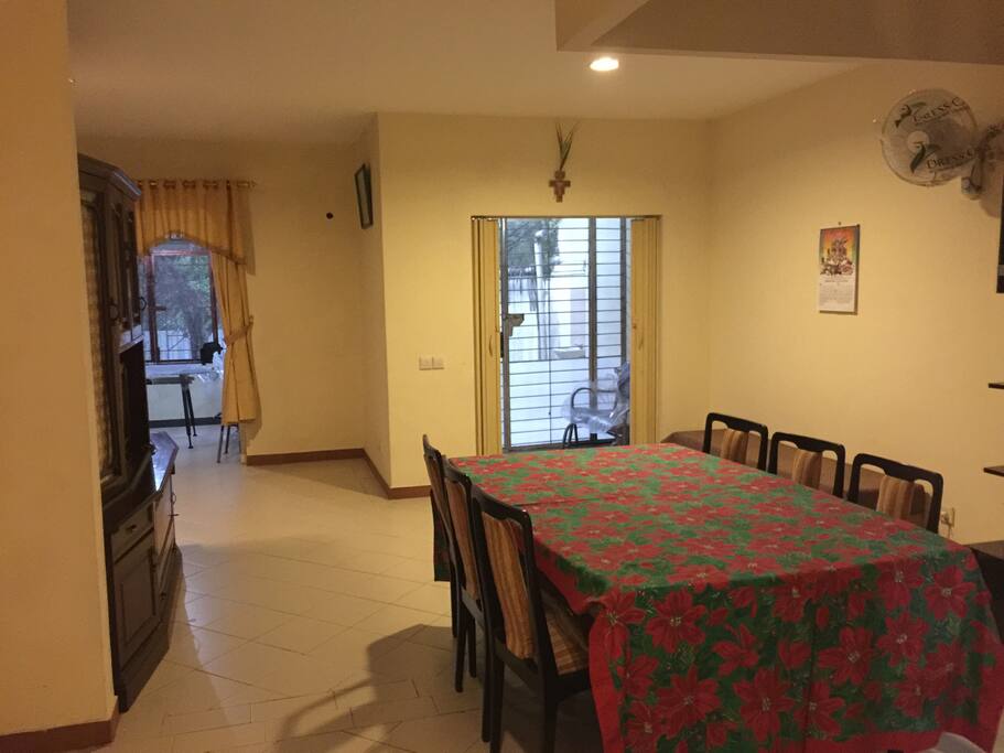 Side by side family room and dining room create spacious space for family gathering with nice view of the back yard