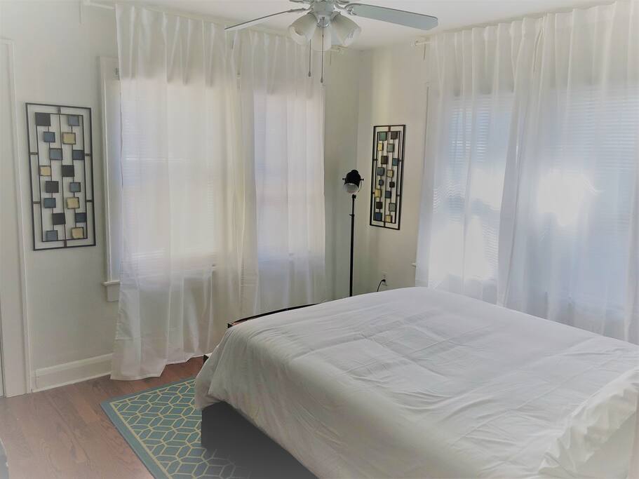 Queen bed with memory foam topper for a comfortable sleep
