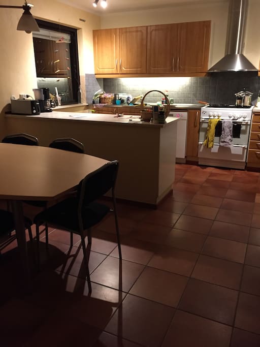 Spacious kitchen that holds the hole family