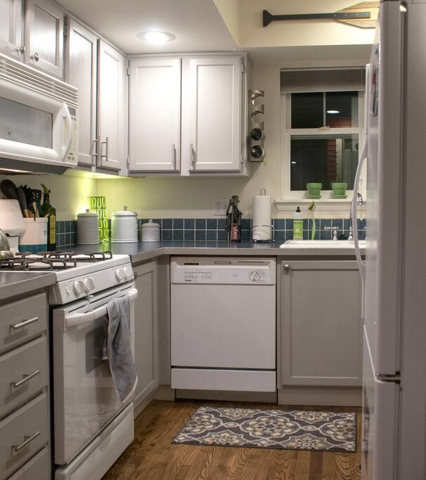 The kitchen, Nespresso maker on the other side of the fridge.
