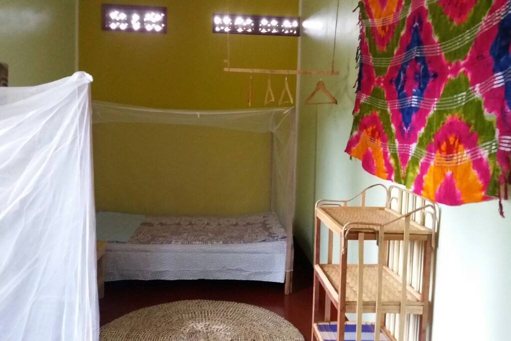Two beds in a beautifully coloured bedroom