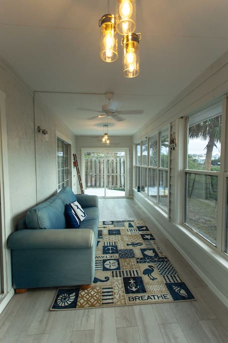 Sunroom to take the view or nap on a rainy day.
