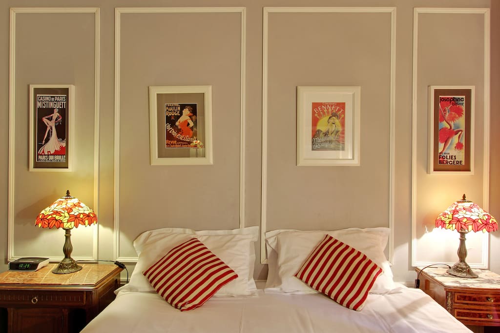 The owners have taken great care to decorate their Paris vacation apartment with antiques and vintage pictures.