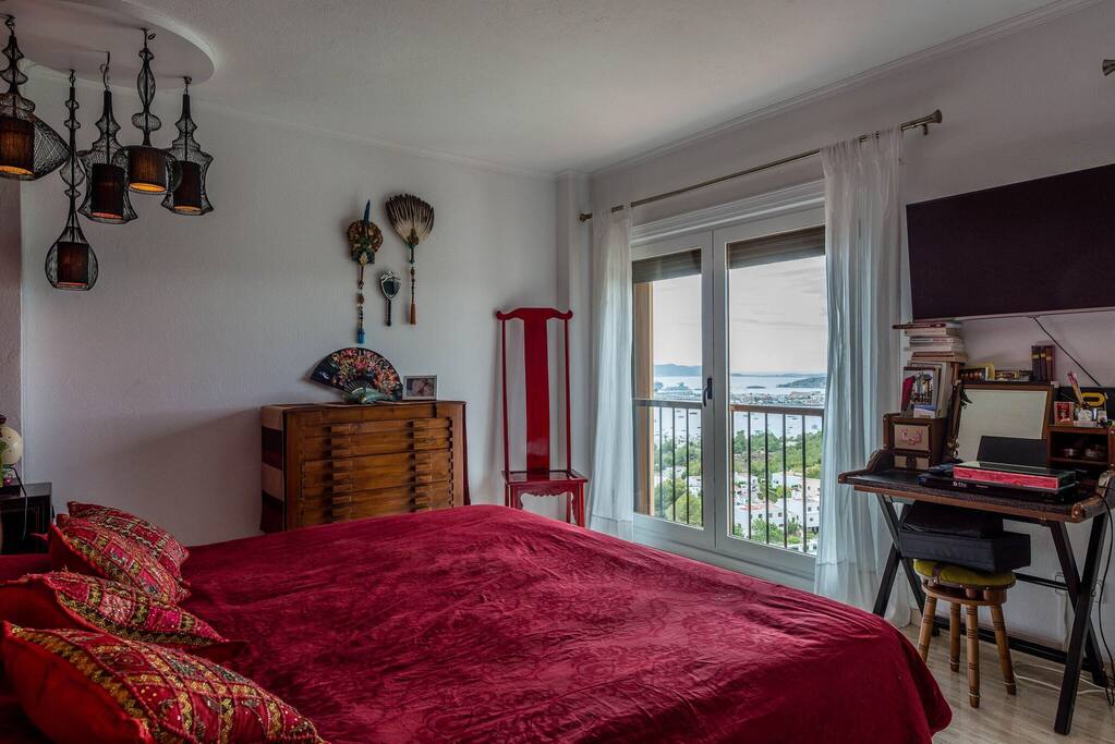 Master bedroom with king size bed & bathroom & sea view