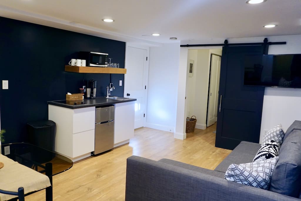 Spacious living/lounge area that includes light dimmer and usb outlets throughout