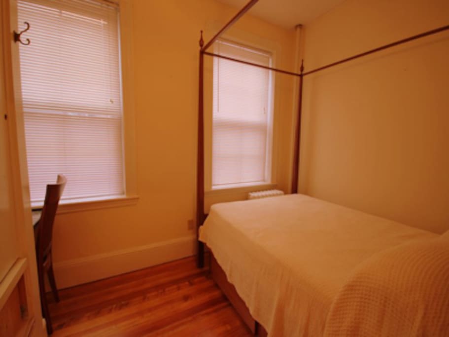 Full-sized, four poster bed with Sealy Posturepedic mattress
