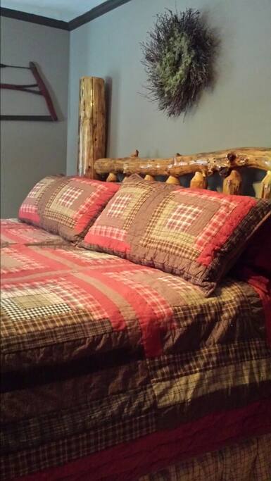 This is the Hunting Room! Very unique custom log bed and with Antiquities of old Hunting and Trapping days.