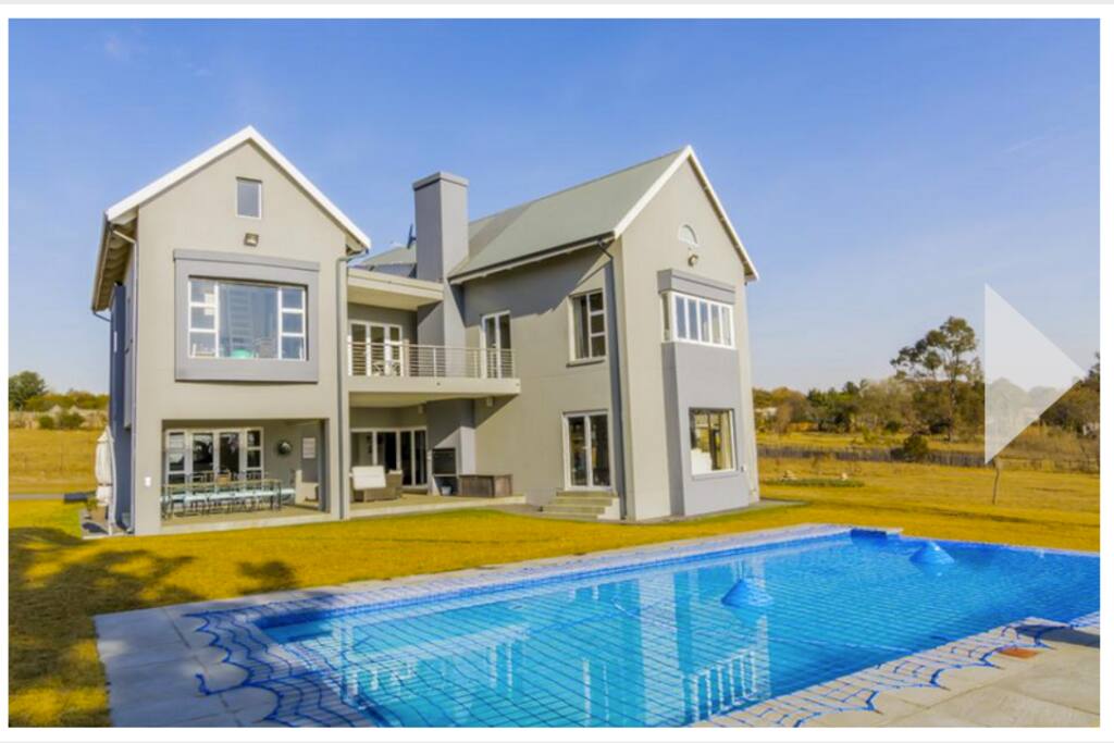 Front view of house. Pool is now fenced off.