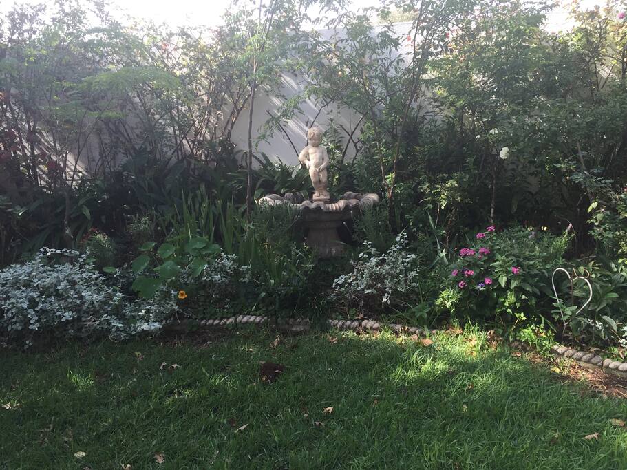 view of garden from french doors of cottage
