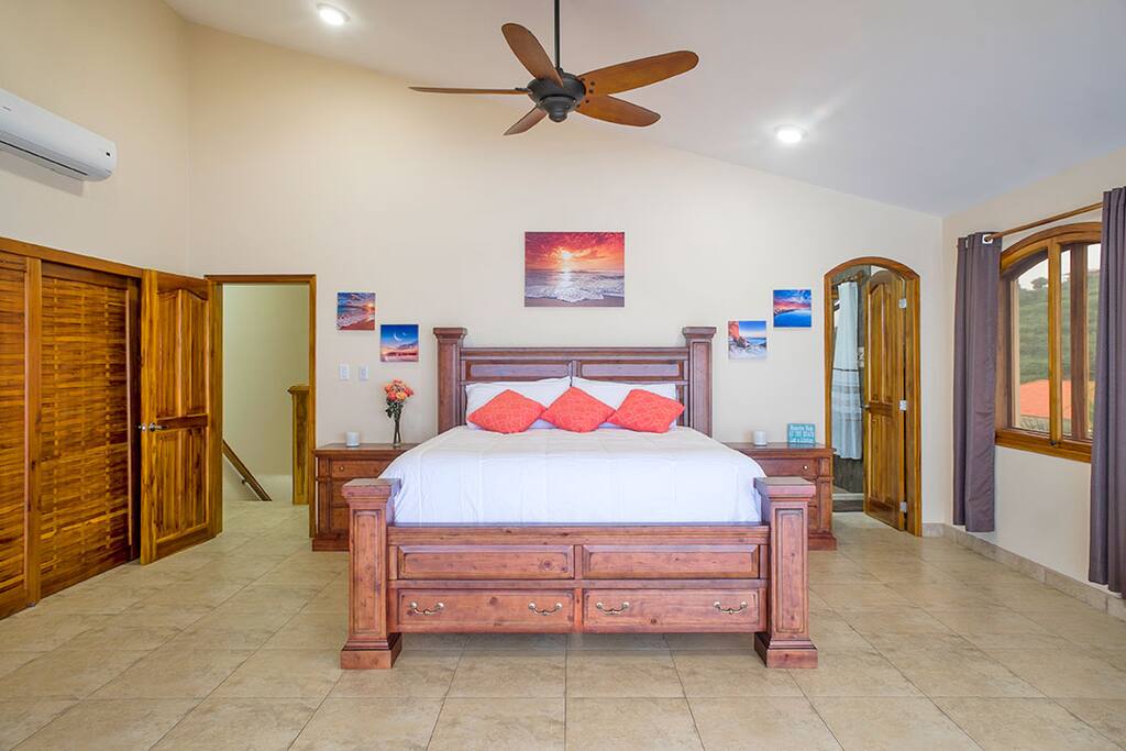 King size bed with imported bedding, dual nightstands.