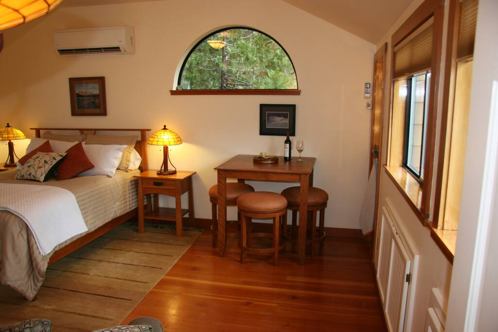 A small dining table for a light breakfast or a glass of wine and cheese and crackers.