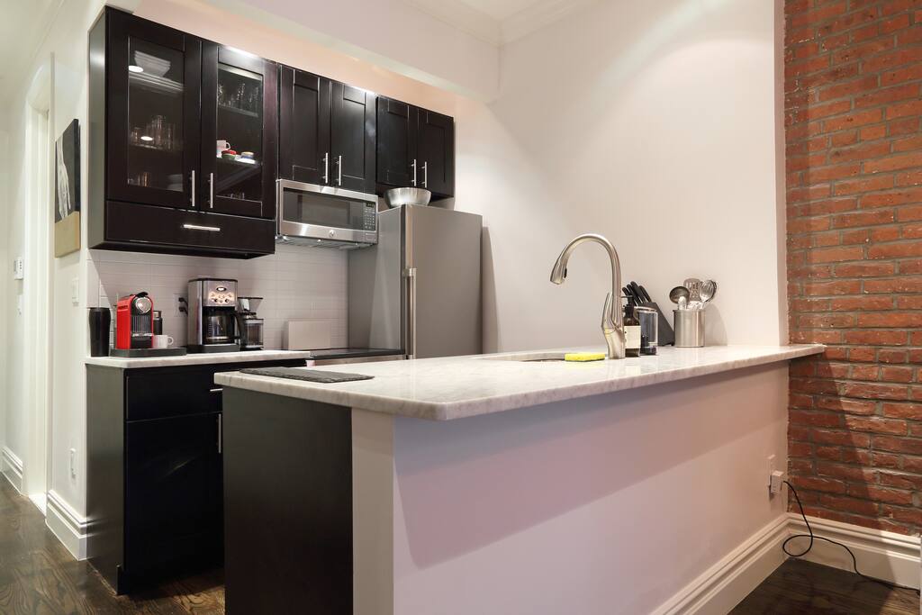 Kitchen w/ Carrara marble, dishwasher, Nespresso machine