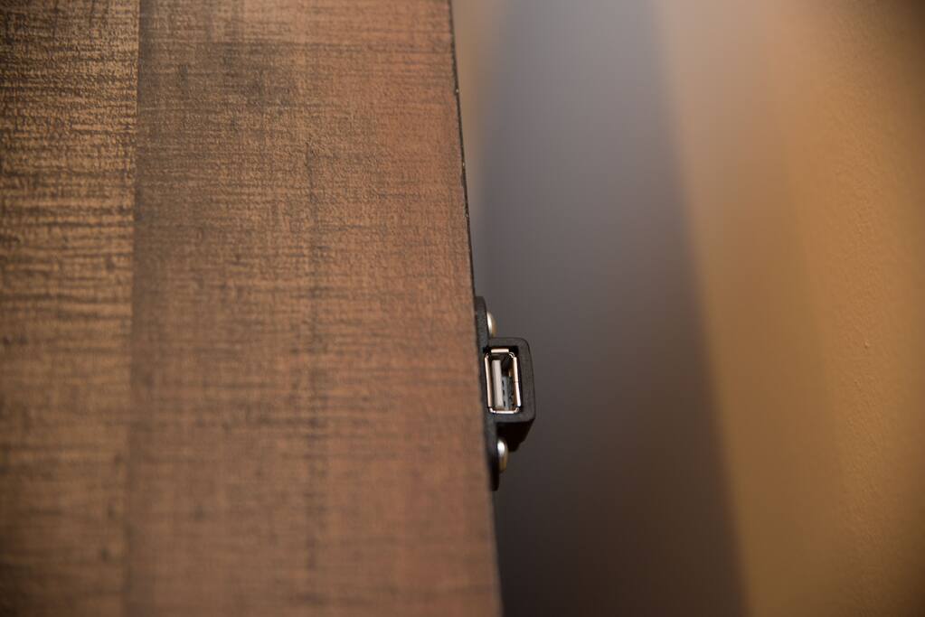 Bedside tables compatible with USB charging devices.