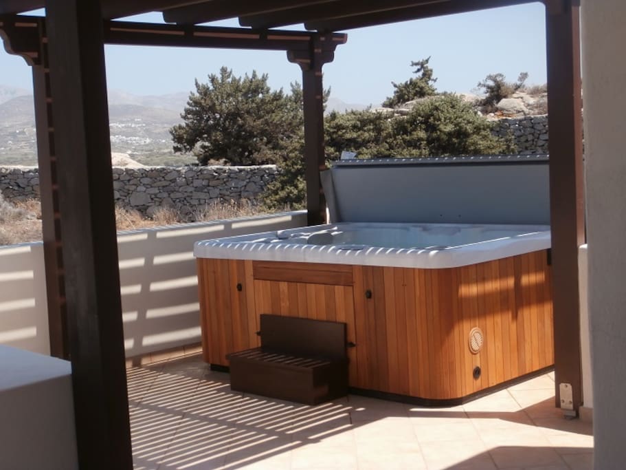Private outdoor heated hot tub with panoramic views of the sea, Naxos Town and the surrounding area