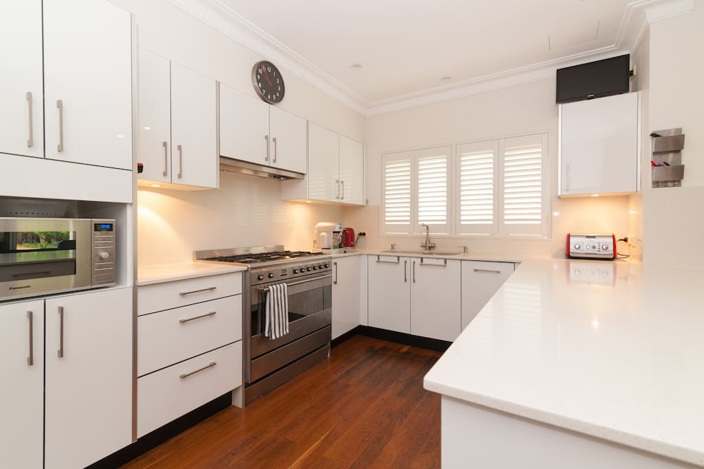 Large modern kitchen, gas booking, and two dishwashers.