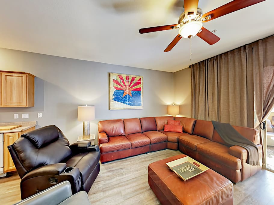 Gather in the comfy living room for a movie night on the 65” flat screen TV.