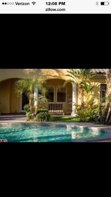 Covered loggia facing pool
