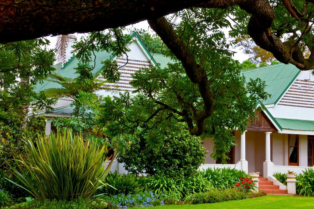 The architecture of over a 100 years ago is surrounded by a breathtaking garden...