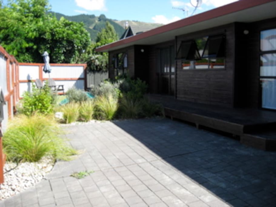 front of house gets early morning sun, nice place to sit and eat breakfast before a busy day.