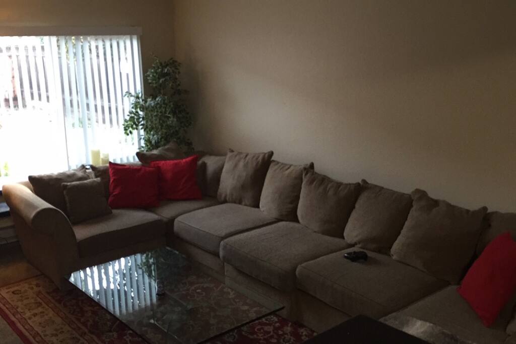 Full couch, seats 10 comfortably. Beautiful 2 piece glass table