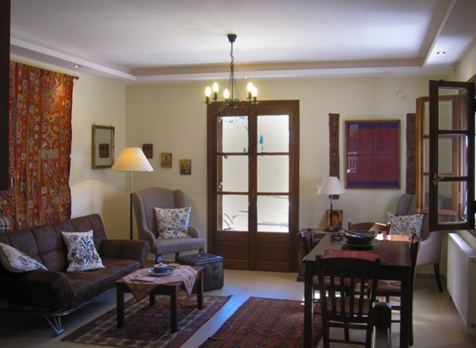 living room with a balcony facing the red rock mountain
