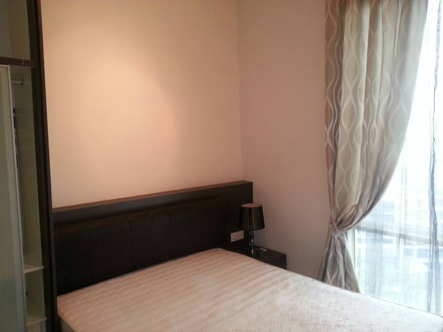 Master bedroom with queen size bed.