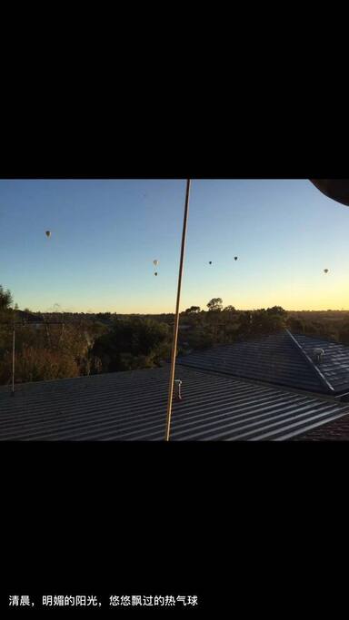 View from the room window---hot air balloon in the early morning