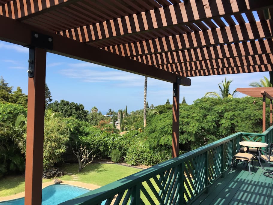 Upper lanai with a view of the ocean from your bedroom