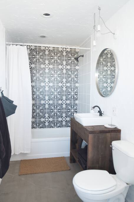 Totally renovated bathroom with lovely Portuguese tile.